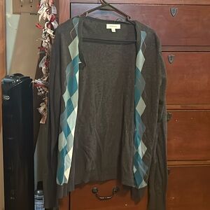 A cute grey sweater, with a blue pattern down the sides